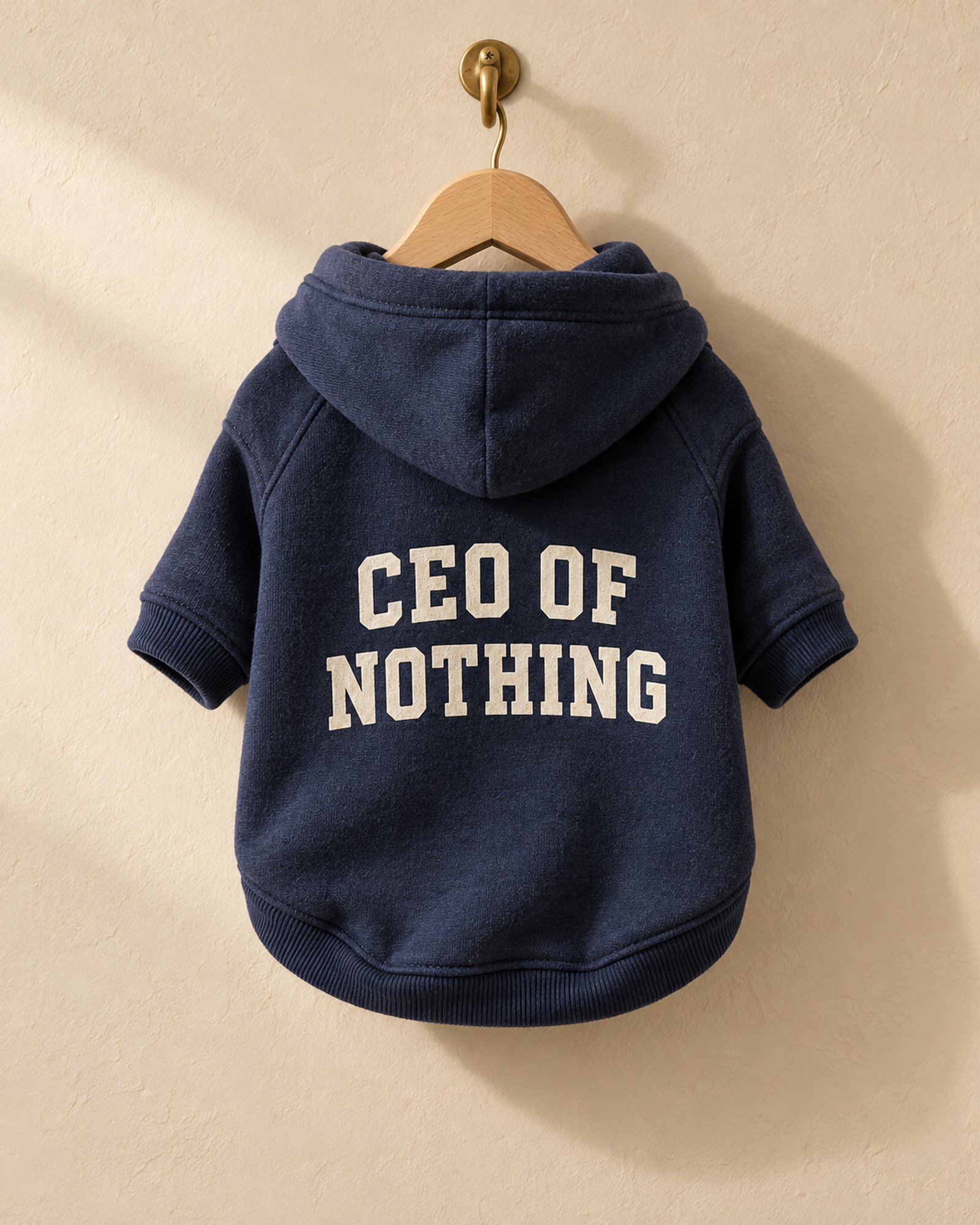 Navy CEO of Nothing dog hoodie on a hanger, back print
